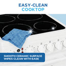 White electric range cooktop with four ceramic elements and front control knob panel