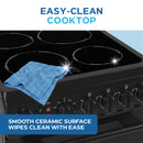 Black ceramic glass cooktop with four radiant coil burners and control knobs