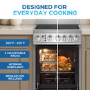 Electric range with open oven and interior light, two racks, ceramic glass cooktop.