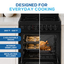 Black electric range open oven showing food on racks and front control panel