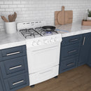 White compact gas range with burner grates and oven door with control knobs