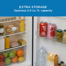 Compact refrigerator door open with shelves for bottles, cans, and jars