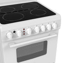 White electric range cooktop with ceramic glass and control knobs close-up