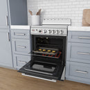White electric range with ceramic glass cooktop, open oven door and baking tray inside