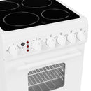White ceramic glass cooktop with four smooth electric burners and control knobs