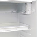 Inside view of compact refrigerator with upper vent panel and glass shelf